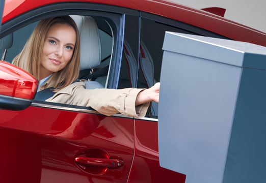 Employee leaving company parking using an access badge